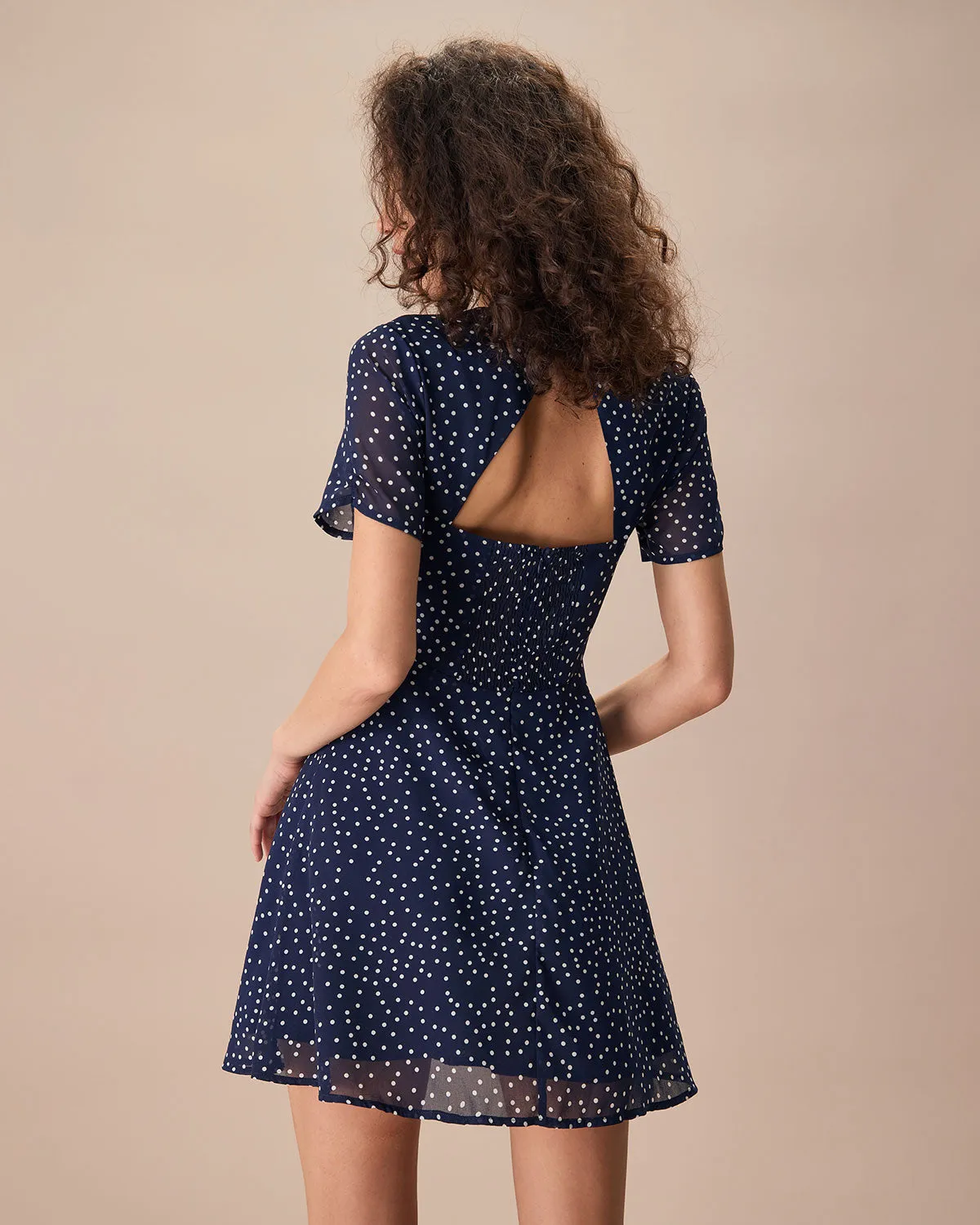 The Navy Crew Neck Polka Dot Cutout Mini Dress
